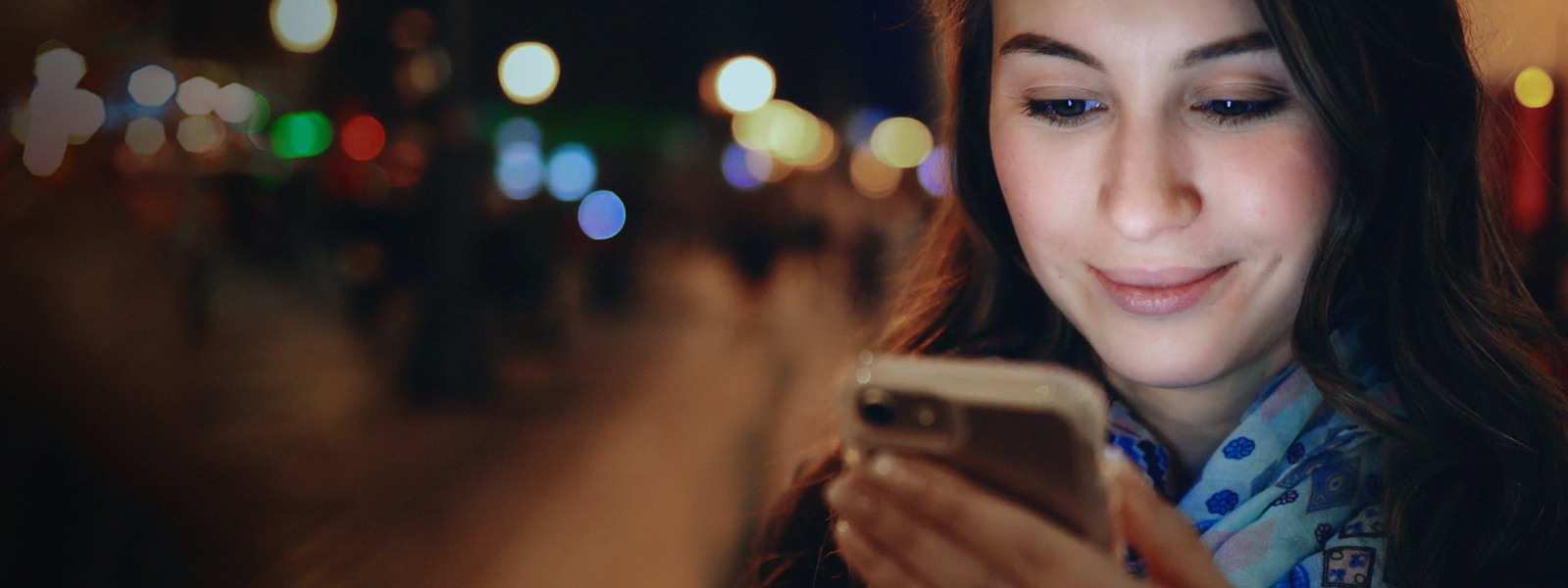 Visa ID Intelligence woman looking at phone